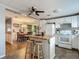 Bright, classic kitchen featuring white cabinetry, butcher block island, and stylish backsplash, perfect for home cooking at 6739 Kensington Ne Dr, Winter Haven, FL 33881