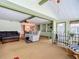Inviting living room featuring classic furnishings, built-in shelving, and seamless transitions into adjacent dining area at 6739 Kensington Ne Dr, Winter Haven, FL 33881