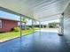 Spacious covered patio area offering ample space for outdoor seating and entertaining at 6739 Kensington Ne Dr, Winter Haven, FL 33881