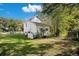 Spacious backyard with grassy area and white house at 907 Cornelia Ave, Lakeland, FL 33803