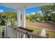 Charming front porch view overlooking a tree-lined street at 907 Cornelia Ave, Lakeland, FL 33803