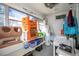 Functional laundry room with washer, dryer, and storage shelves at 907 Cornelia Ave, Lakeland, FL 33803