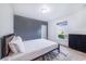 Bedroom with gray accent wall and ample natural light at 1518 Blue Sky Blvd, Haines City, FL 33844