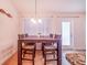 Bright dining area with table and chairs, near kitchen at 1518 Blue Sky Blvd, Haines City, FL 33844