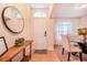 Bright and airy entryway with a console table and mirror at 1518 Blue Sky Blvd, Haines City, FL 33844