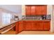 Kitchen with granite countertops and wood cabinets at 1518 Blue Sky Blvd, Haines City, FL 33844