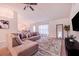 Relaxing living room featuring an L-shaped sofa and ceiling fan at 1518 Blue Sky Blvd, Haines City, FL 33844