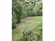 Secluded backyard with mature trees and plenty of space for outdoor activities at 4450 Old Berkley Rd, Auburndale, FL 33823