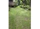 Beautiful backyard featuring a spacious deck and lush landscaping at 4450 Old Berkley Rd, Auburndale, FL 33823