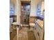 Bathroom with a tiled shower, modern fixtures, and white cabinetry at 4450 Old Berkley Rd, Auburndale, FL 33823