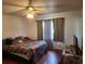 Cozy bedroom with hardwood floors and a ceiling fan at 4450 Old Berkley Rd, Auburndale, FL 33823