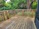 Wooden deck features lattice railing and offers a cozy spot to relax outdoors at 4450 Old Berkley Rd, Auburndale, FL 33823