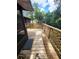 Exterior wooden deck features wood railings and latticework, perfect for outdoor relaxation at 4450 Old Berkley Rd, Auburndale, FL 33823