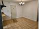 Bright dining room featuring tile floors and modern lighting fixture at 4450 Old Berkley Rd, Auburndale, FL 33823