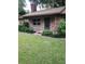 Charming front door with brick exterior and manicured landscaping at 4450 Old Berkley Rd, Auburndale, FL 33823