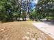 A well maintained front yard with a long driveway at 4450 Old Berkley Rd, Auburndale, FL 33823