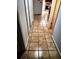 Hallway with tile flooring connecting rooms at 4450 Old Berkley Rd, Auburndale, FL 33823