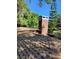 Roof of the home with asphalt shingles and a brick chimney at 4450 Old Berkley Rd, Auburndale, FL 33823