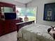 Bright bedroom with a large window, dresser, and attractive decor at 416 Sandestin Dr, Winter Haven, FL 33884