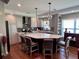 Spacious kitchen showcasing the large island with seating, stainless steel appliances, and ample cabinet space at 416 Sandestin Dr, Winter Haven, FL 33884