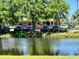 Scenic view of community area near the clubhouse and a peaceful pond at 416 Sandestin Dr, Winter Haven, FL 33884