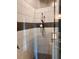 Walk-in shower featuring subway tile walls, a shower head, and glass door at 416 Sandestin Dr, Winter Haven, FL 33884