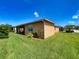 Manicured lawn and screened in patio at 4577 Back Nine Dr, Winter Haven, FL 33884