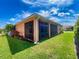 A well-maintained lawn and enclosed porch area at 4577 Back Nine Dr, Winter Haven, FL 33884
