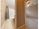 The bathroom next to the bedroom has tiled floors and a shower and bathtub combo at 4577 Back Nine Dr, Winter Haven, FL 33884