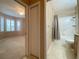 The bathroom is located next to the carpeted bedroom and features a shower at 4577 Back Nine Dr, Winter Haven, FL 33884