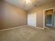 This carpeted bedroom features a closet and a ceiling fan at 4577 Back Nine Dr, Winter Haven, FL 33884