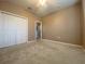 A carpeted bedroom with a closet and a ceiling fan at 4577 Back Nine Dr, Winter Haven, FL 33884