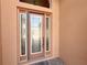 Elegant front door with glass panels and sidelights welcomes you to this beautifully maintained home at 4577 Back Nine Dr, Winter Haven, FL 33884