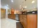 Modern kitchen with stainless steel appliances, granite countertops, and custom cabinetry at 4577 Back Nine Dr, Winter Haven, FL 33884