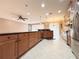 Open kitchen featuring a large island, stainless steel appliances, and a view of the living area at 4577 Back Nine Dr, Winter Haven, FL 33884