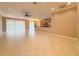 Expansive living room with tile flooring, ceiling fan, and sliding glass doors leading to the outdoors at 4577 Back Nine Dr, Winter Haven, FL 33884