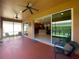 The covered porch with patio furniture has a nice view to the backyard at 4577 Back Nine Dr, Winter Haven, FL 33884