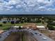 Aerial view of golf course clubhouse with a large parking lot at 6168 Arborea Dr, Lake Wales, FL 33898