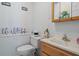 Clean bathroom with wood vanity and updated fixtures at 6168 Arborea Dr, Lake Wales, FL 33898