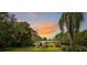 Charming single-story home featuring a lush lawn and mature landscaping, perfect for serene living at 6168 Arborea Dr, Lake Wales, FL 33898