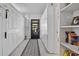 Long hallway with built-in storage and access to the backyard at 6168 Arborea Dr, Lake Wales, FL 33898