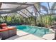 Inviting pool area with screened enclosure at 6168 Arborea Dr, Lake Wales, FL 33898