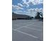 Parking lot with golf carts and palm trees at 680 Augusta Rd, Winter Haven, FL 33884