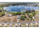 Stunning aerial view of a lakeside property with a pool and solar panels at 1396 Lucerne Loop Ne Rd, Winter Haven, FL 33881