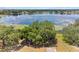 Stunning aerial view of a treehouse and the lake at 1396 Lucerne Loop Ne Rd, Winter Haven, FL 33881