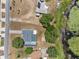 Aerial view of home with pool and long drive next to pond at 1396 Lucerne Loop Ne Rd, Winter Haven, FL 33881