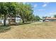 Backyard featuring a treehouse with access to the lake at 1396 Lucerne Loop Ne Rd, Winter Haven, FL 33881