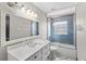 Bathroom featuring a vanity with a sleek countertop and a tiled shower/tub at 1396 Lucerne Loop Ne Rd, Winter Haven, FL 33881