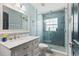 Modern bathroom with stylish vanity, marble countertop, and glass-enclosed shower, offering a spa-like experience at 1396 Lucerne Loop Ne Rd, Winter Haven, FL 33881