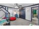 Comfortable bedroom with playful decor and a connecting door, creating a versatile and inviting space at 1396 Lucerne Loop Ne Rd, Winter Haven, FL 33881